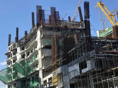 Multistory Building Under Construction with Scaffolding reinforcement Stock Photos
