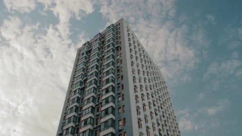 Multistory modern apartment building with clouds flying in the sky Stock Footage 223127182