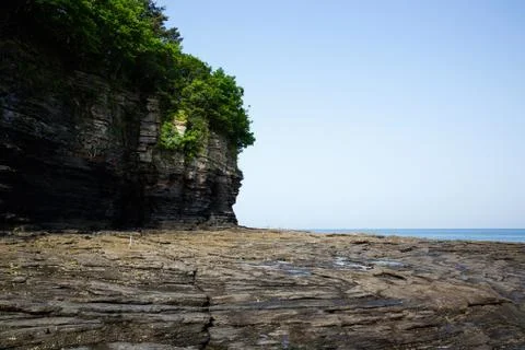 Multistory layered rough and sedimentary rocks Foto stock