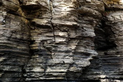 Multistory layered rough and sedimentary rocks Foto stock