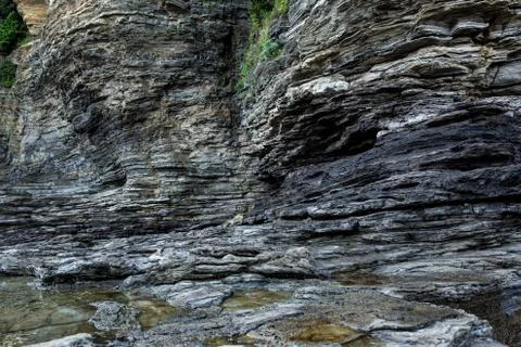 Multistory layered rough and sedimentary rocks Stock Photos