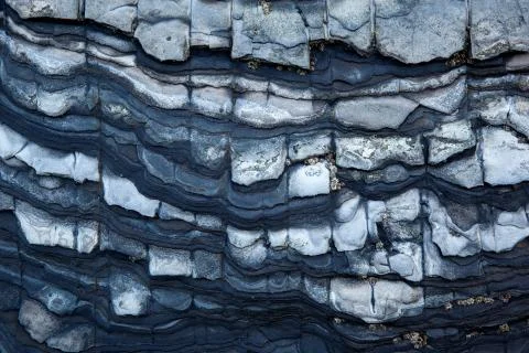 Multistory layered rough and sedimentary rocks Stock Photos