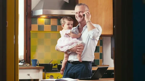 Multitasking business man with child working at home Stock Footage 29710254