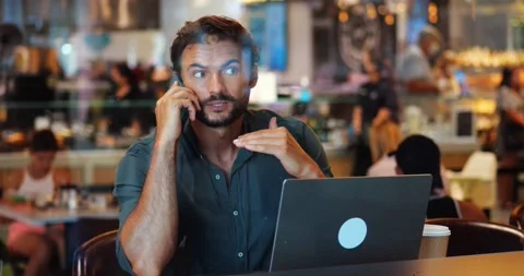 Multitasking charming young bearded Caucasian male entrepreneur, businessman Stock Footage 217903114