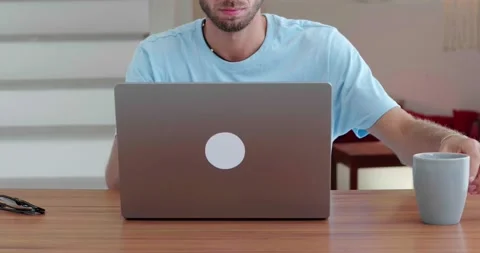 Multitasking European man in blue t-shirt, entrepreneur, copywriter, freelancer Stock Footage 219951793