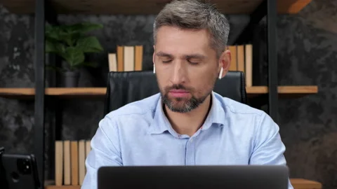 Multitasking man stock trader broker using smartphone, laptop and tablet Stock Footage 166174986