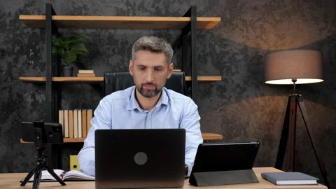 Multitasking man stock trader broker using smartphone, laptop and tablet Stock Footage 168469514