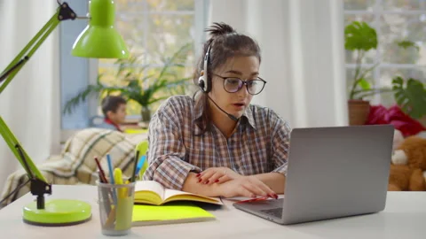 Multitasking mom working remote on laptop is stressed out. Realtime Stock Footage 234049461