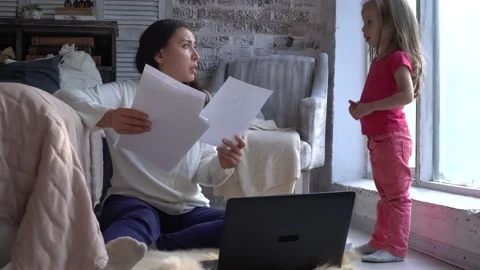 A multitasking mom working remote is stressed out Stock Footage 143492431