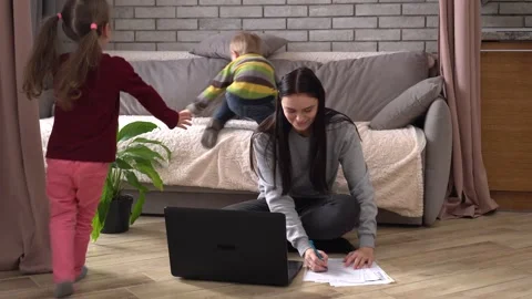 A multitasking mom working remote is stressed out. Work-at-home problems Stock Footage 149097652