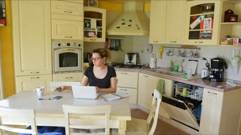 Multitasking teleworking woman Stock Footage