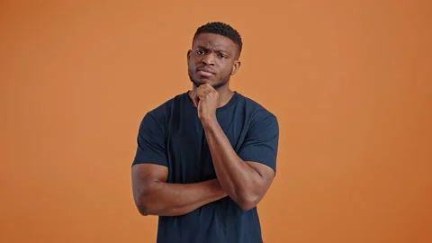 Multitasking thoughtful dark-skinned man, reasoning over problems, pointing Stock Footage 236507526