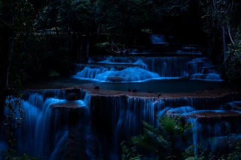 Multitiered Silky Waterfall Cascading In Dark Tropical Forest At Night At H.. 写真素材