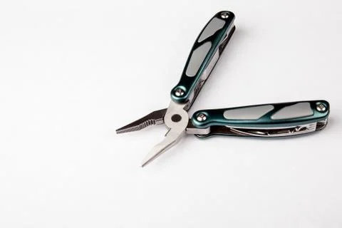 Multitool with pliers on white background. Top view. Tools for cutting, sawing Stock Photos