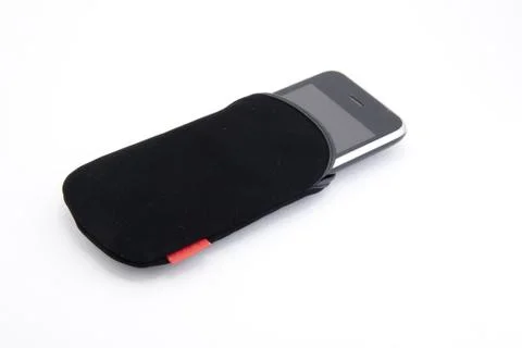 Multitouch smartphone with leather cover Stock Photos