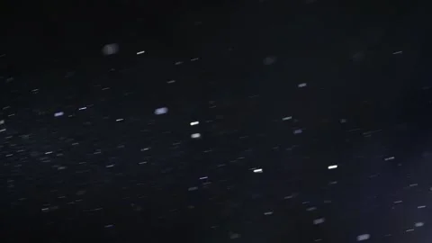 A multitude of dust specks drift through the air,4k 스톡 동영상 306419610