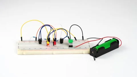 Multivibrator assembled on breadboard board on a white background. Stock Footage 157806321