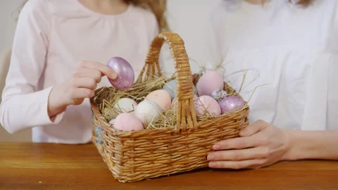 Mum and Daughter Posing with Basket of Easter Eggs Stock Footage 126339768