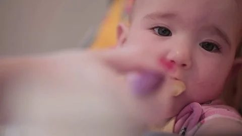 Mum feeds the child Stock Footage