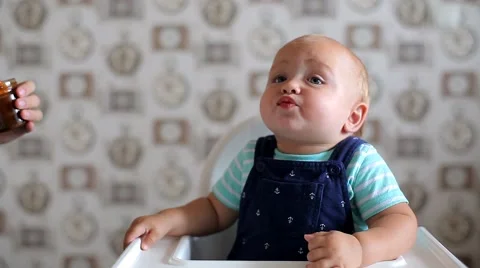 Mum Feeds the Child with a Spoon Stock Footage 52158950