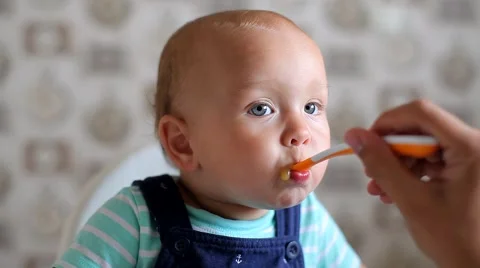 Mum Feeds the Child with a Spoon Video stock 52158983