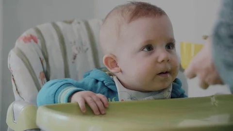 Mum Feeds the Child with a Spoon Stock Footage 84817530