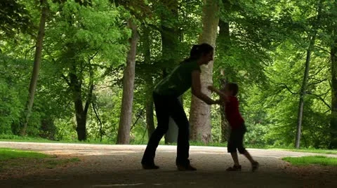 Mum playing with her son in the park Stock Footage 11063032