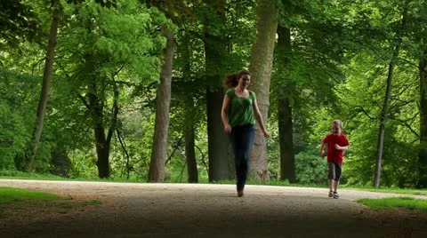 Mum playing with her son in the park2 Stock Footage 11062972