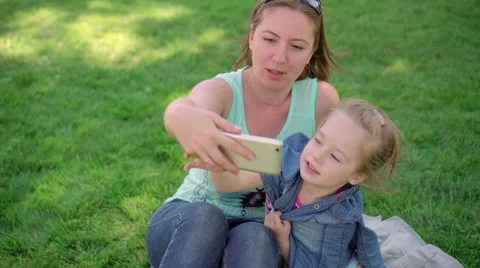 Mum with a small daughter do selfie Stock Footage 68903646