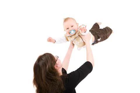 Mum throws the son in air Stock Photos