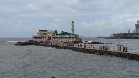 Mumbai- 2024, Sept 08: Crowded Pathway to Haji Ali Dargah with Sea and Birds. Stock Footage 291962451