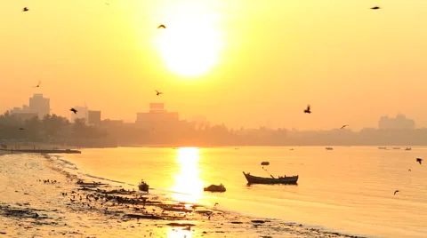 Mumbai India Asia Chowpatty Beach sunrise ocean birds Stock Footage