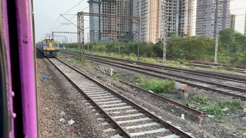 Mumbai Local Train and AC Local Passing Each Other on Track Vídeos de archivo 335711702