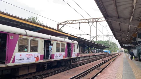 Mumbai Local Train Arrival - September 10, 2024, Maharashtra, India Stock Footage 285714806