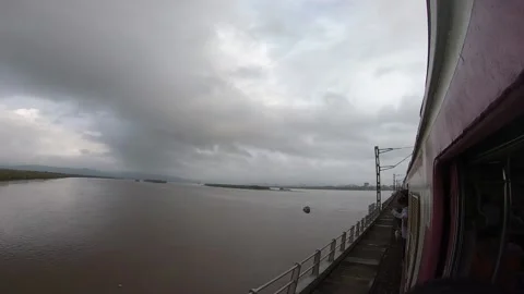 Mumbai local train going over the bridge. Naigaon to bhayandar. Mumbai India. Stock Footage 131178505