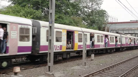 Mumbai local train passing Stock Footage 241242439