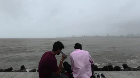 Mumbai Marine Drive Seafront Crowd Enjoying High Tide Waves 4K Stock Footage 339317489