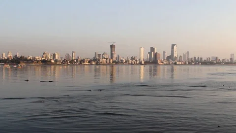 Mumbai Skyline and its reflection in water during Sunset Stock Footage 108529655