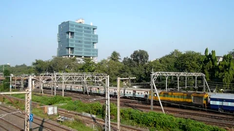 Mumbai Suburban Local Engine train moving Speed Ariel Traffic Dadar India Stock Footage 143197124