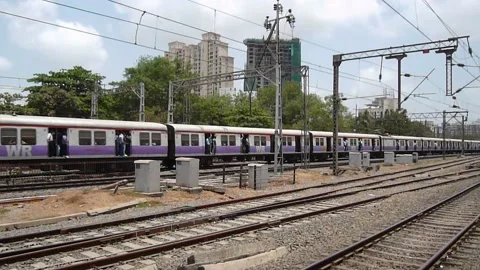 Mumbai Suburban Local train speeding near Goregaon railway station Mumbai India Stock Footage 153162811