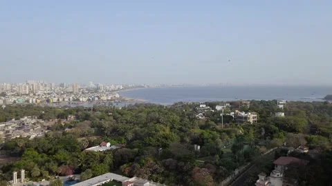 Mumbai Versova beach with helicopter passing by Stock Footage