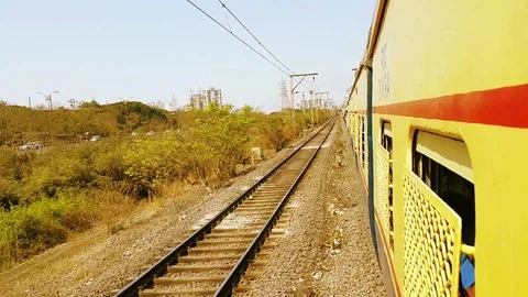 Mumbai Yellow Local Train Running on Tracks Stock Footage 109410295