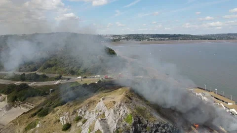Mumbles pier fire and grass hill in flames Stock Footage 208068187