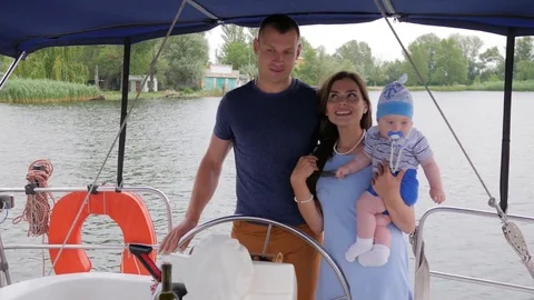 Mum,dad and son in open air, happy parents with child on rest in background Stock Footage