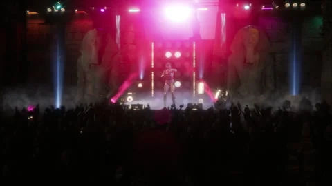 Mummy queen rocks the stage before an alien crowd in a temple Stock Footage 293740087
