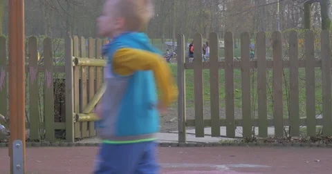 Mums Settled Down on Benches Near to a Playground Stock Footage 61897748