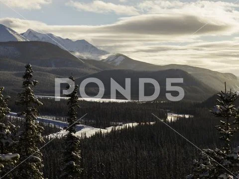 Muncho Lake in winter, Muncho Lake Provincial Park; British Columbia, Canada Stock Photos