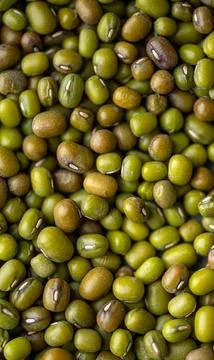Mung beans fill the frame, presenting a whole grain texture ideal for showcas Stock Photos