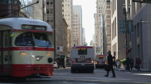 Muni passes through downtown intersection Stock Footage 36923543