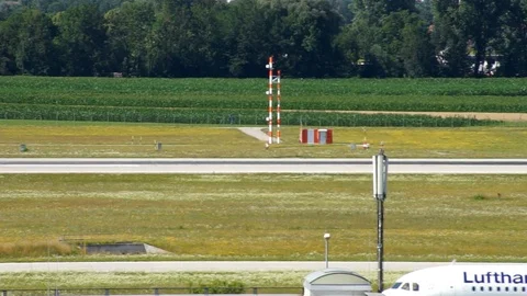 Munich Airport two Lufthansa planes on tarmac Stock Footage 100460604